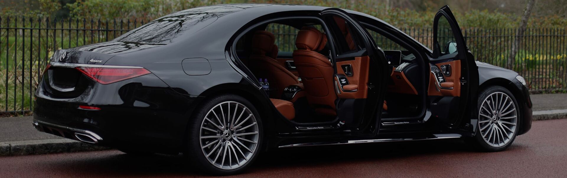 Black executive car on a quiet London street